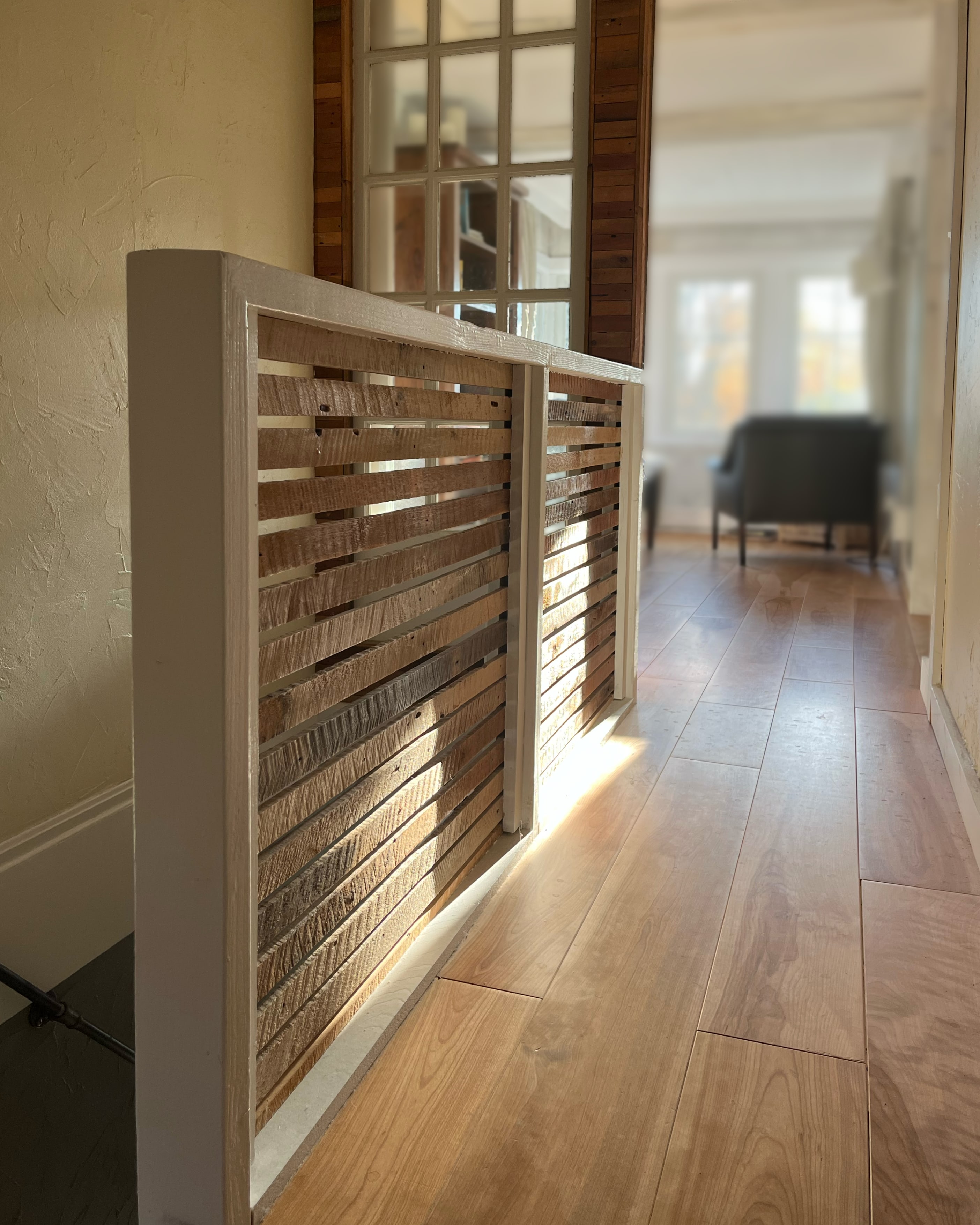 Person sitting on floor working on laptop