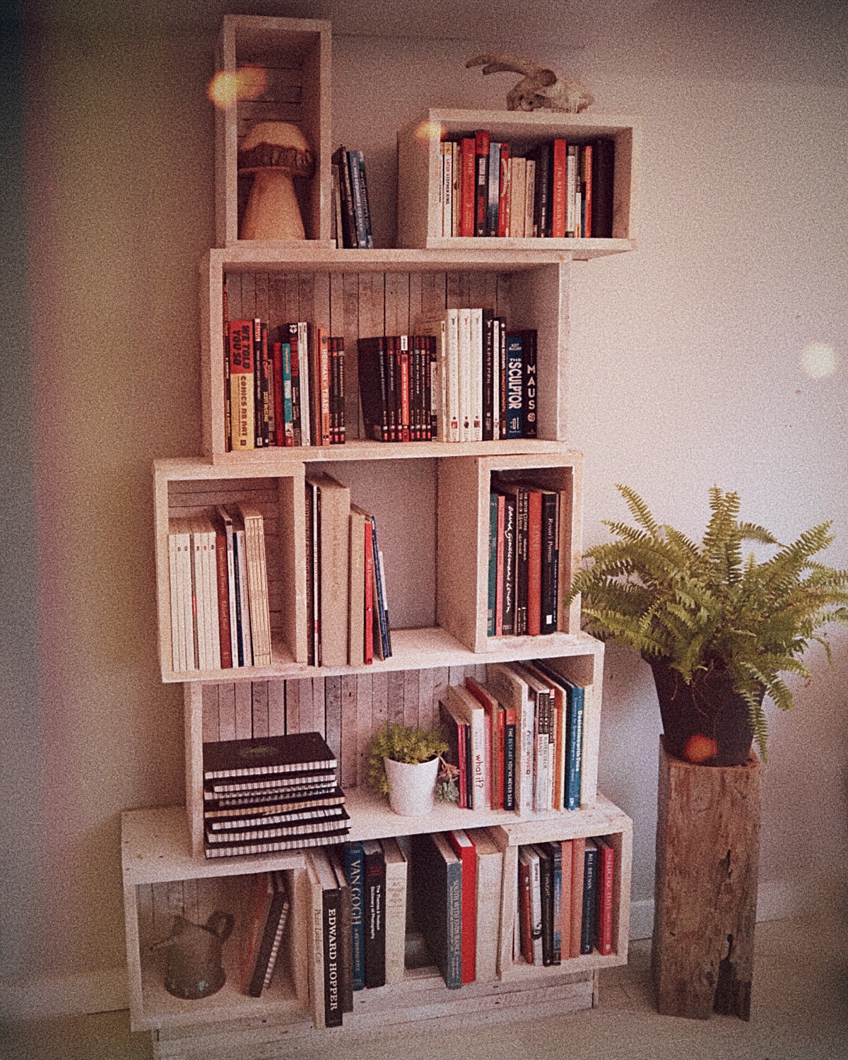 Person sitting on floor working on laptop